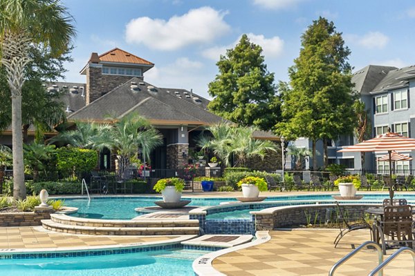 Poolside oasis at Mandalay at Shadow Lake Apartments featuring luxurious lounge chairs and sparkling water for ultimate relaxation