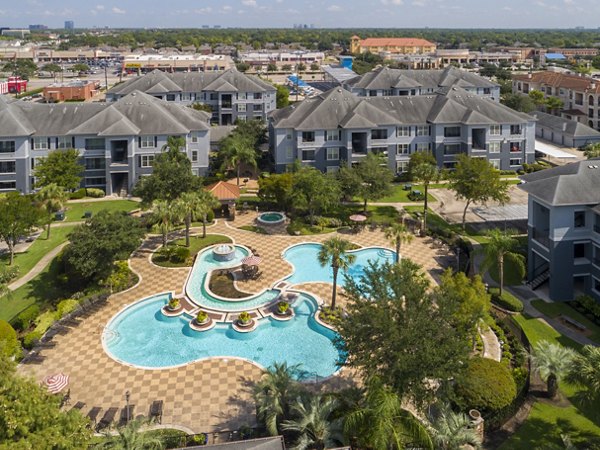 Luxurious pool with surrounding lounge chairs at Mandalay at Shadow Lake Apartments, perfect for relaxation and outdoor recreation