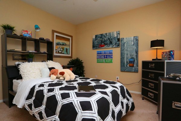 Luxurious bedroom with stylish decor at Lake Vue Apartments, offering comfort and elegance in a premier location