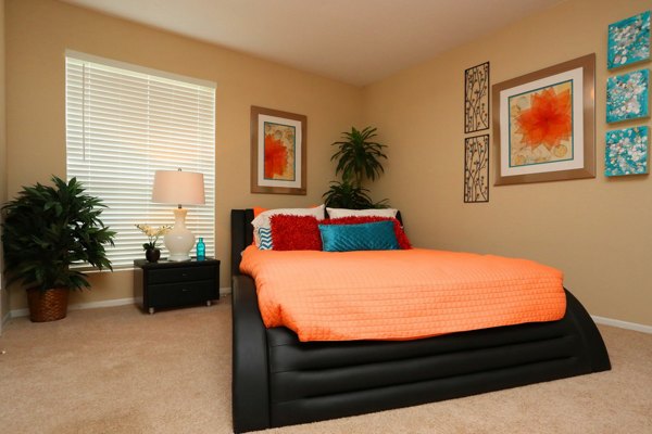 Cozy bedroom with modern furnishings in Lake Vue Apartments