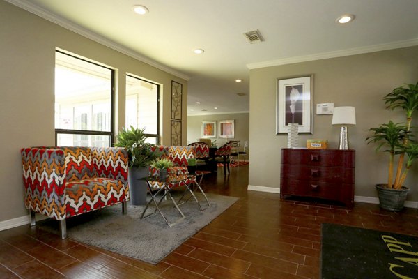 Clubhouse with luxurious lounge and modern decor at Lake Vue Apartments