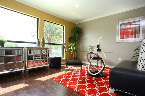 Modern clubhouse with lounge and meeting areas at Lake Vue Apartments, luxury living in a serene setting