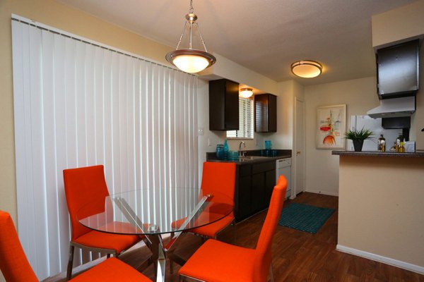 Lake Vue Apartments: Modern dining room with contemporary furnishings and stylish lighting