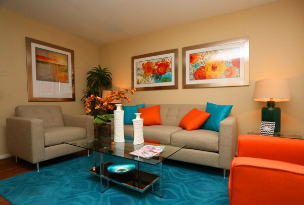 Modern living room with stylish decor and natural light at Lake Vue Apartments
