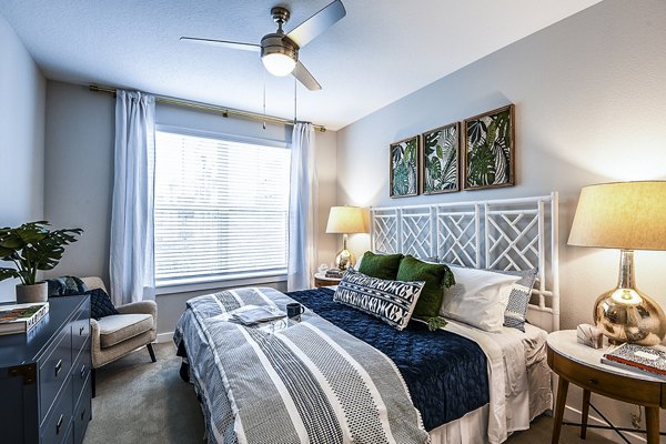 Bedroom featuring modern design and elegant furnishings at Overture Dr Phillips Apartments