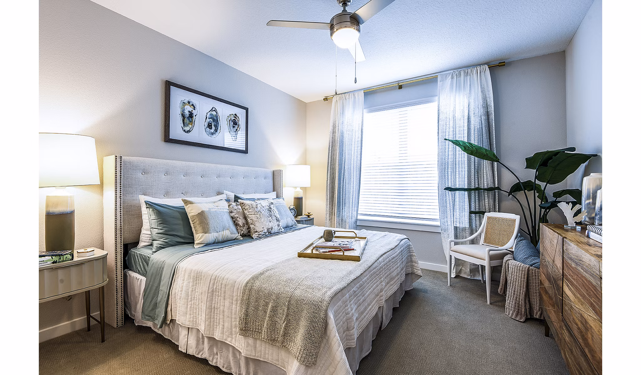 Elegant bedroom with plush bedding at Overture Dr Phillips Apartments