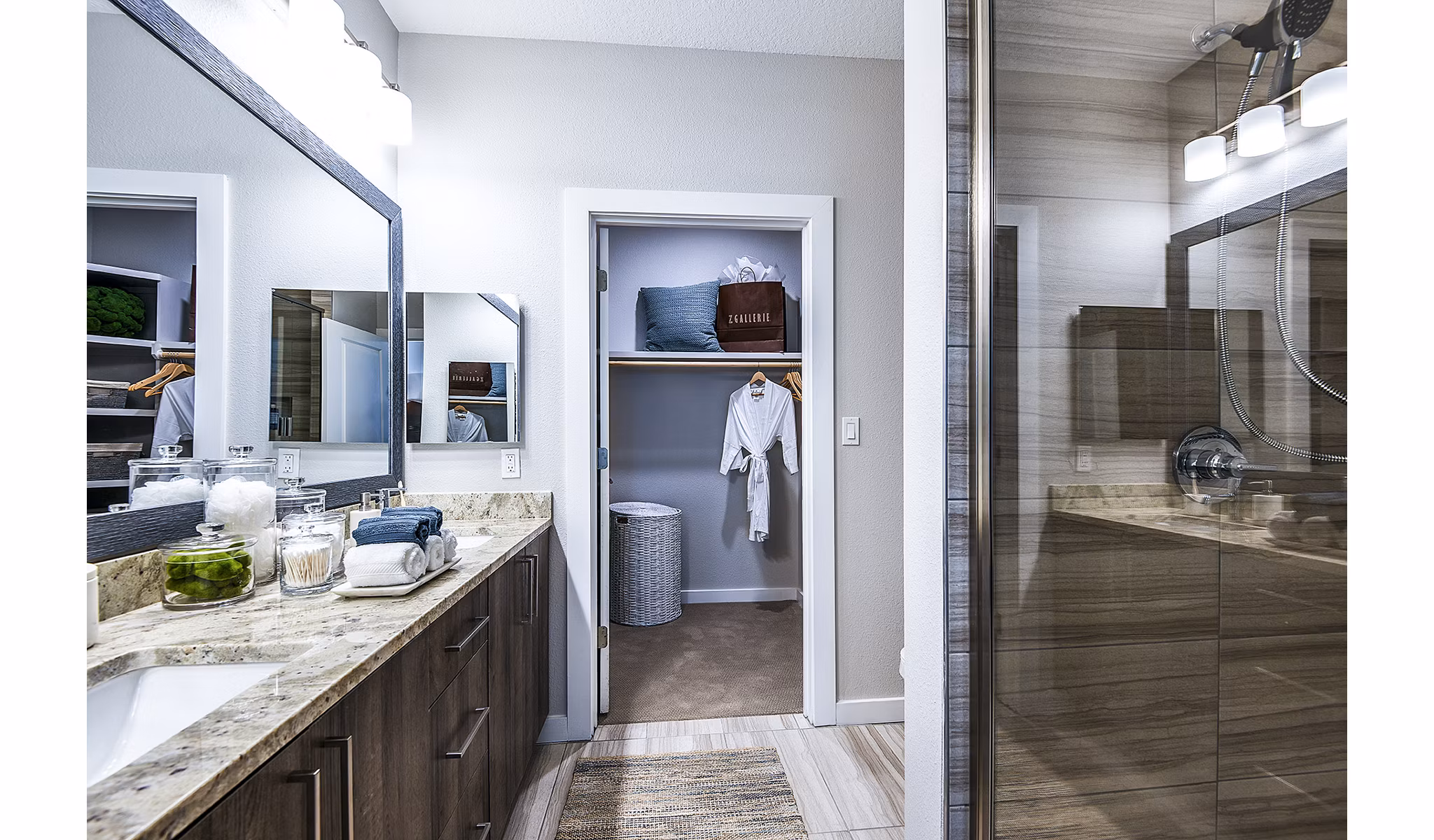 Bathroom featuring elegant marble countertops and modern fixtures at Overture Dr Phillips Apartments - luxury living by Greystar