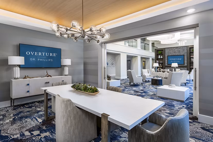 Overture Dr Phillips: Modern meeting facility with sleek design and ample seating, ideal for hosting business gatherings and events