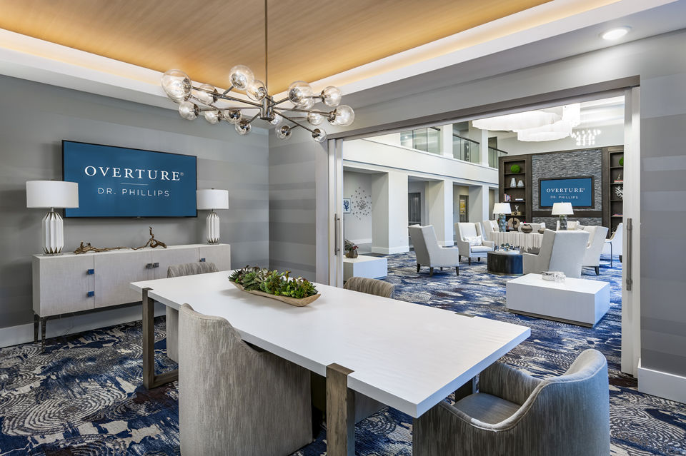 Overture Dr Phillips: Modern meeting facility with sleek design and ample seating, ideal for hosting business gatherings and events