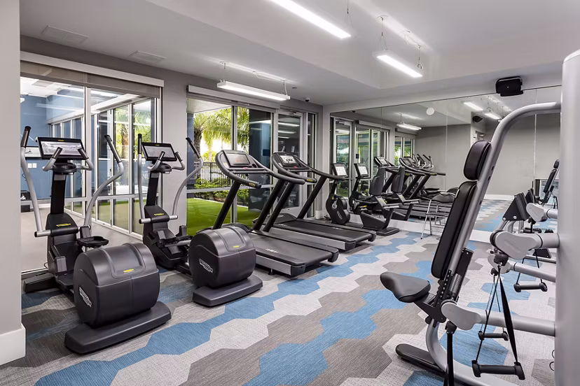 State-of-the-art fitness center at Overture Dr Phillips Apartments featuring modern equipment and spacious workout areas