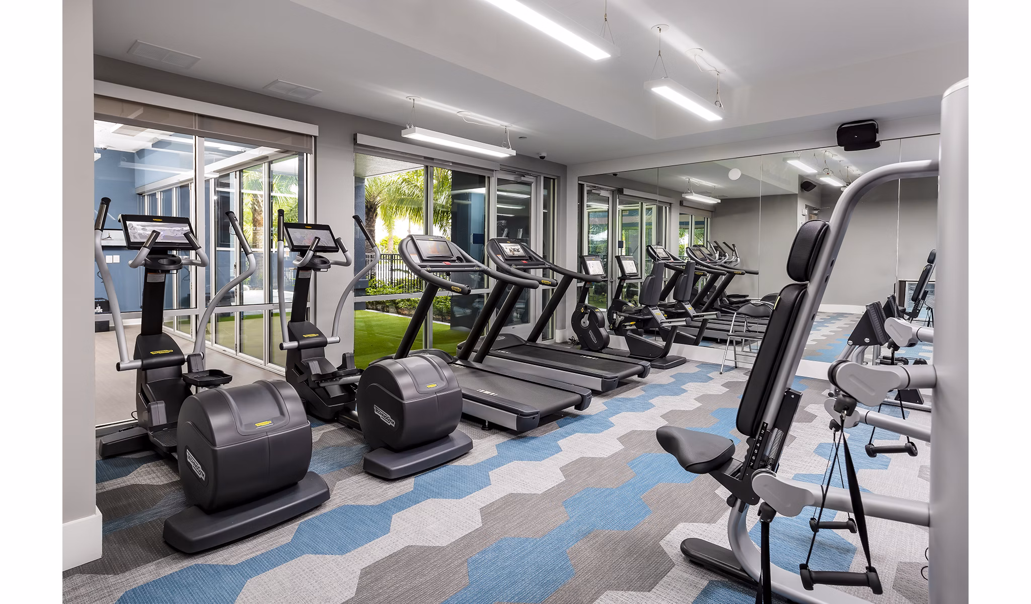 State-of-the-art fitness center at Overture Dr Phillips Apartments featuring modern equipment and spacious workout areas