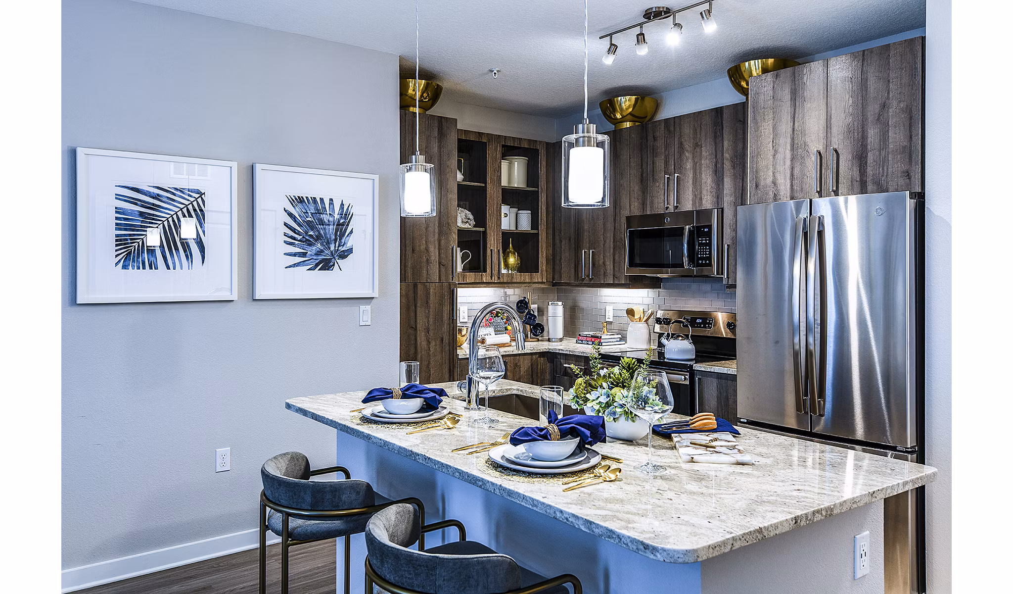 Modern kitchen with sleek cabinetry and stainless steel appliances at Overture Dr Phillips Apartments
