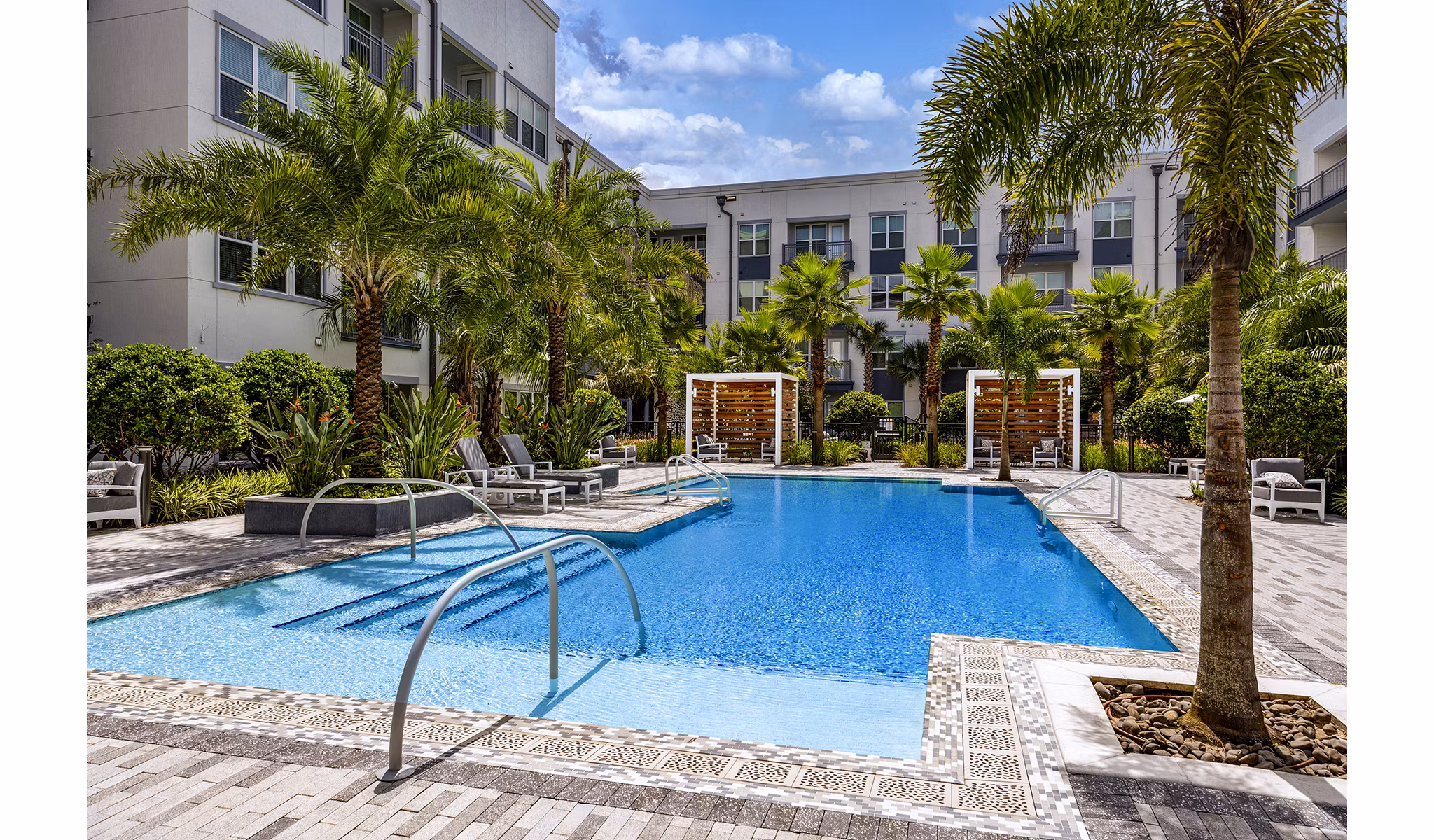 Modern outdoor pool area at Overture Dr Phillips Apartments, featuring resort-style amenities for relaxation and leisure