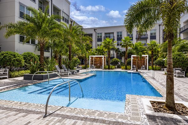Modern outdoor pool area at Overture Dr Phillips Apartments, featuring resort-style amenities for relaxation and leisure