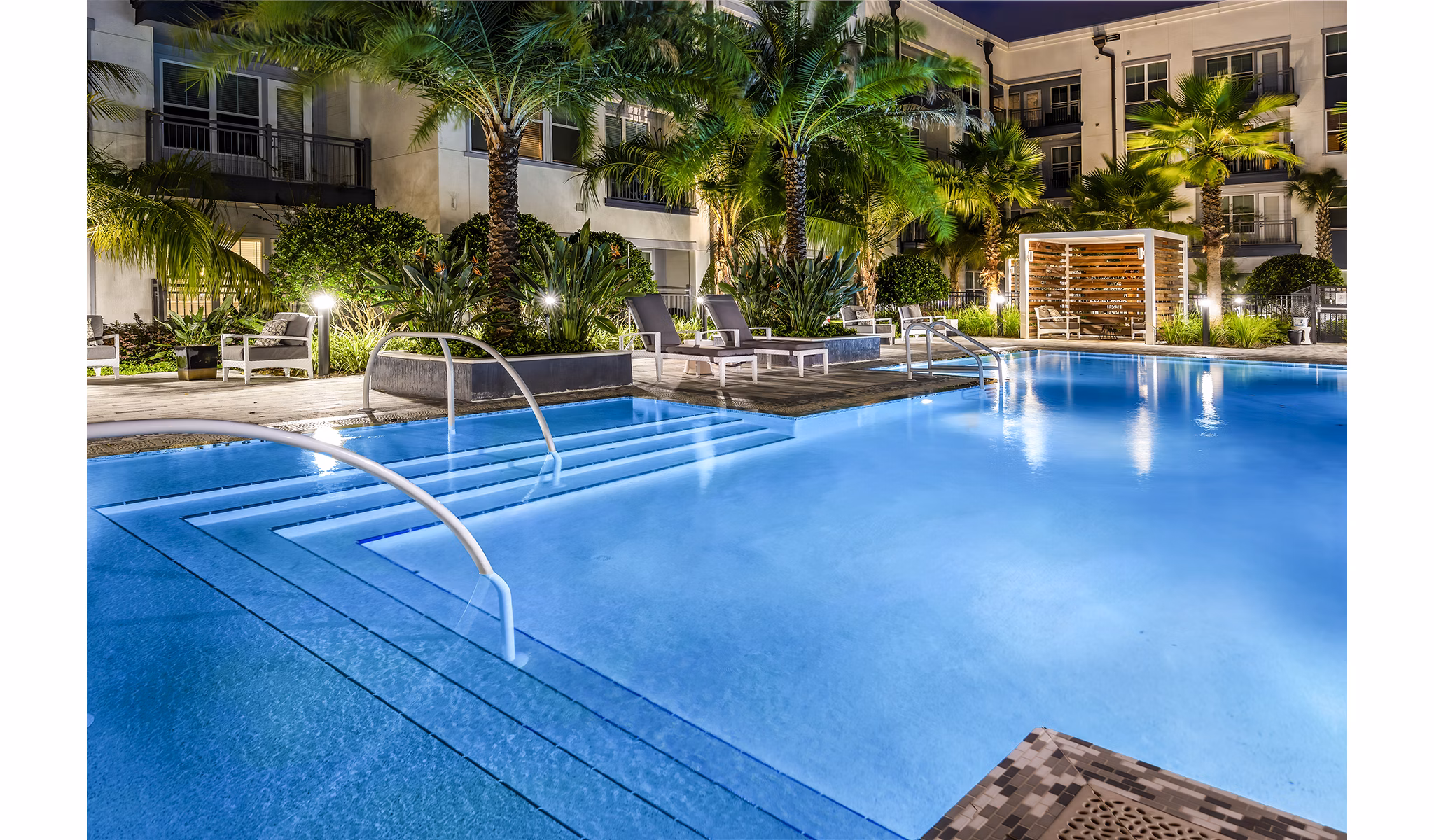 Refreshing outdoor pool at Overture Dr Phillips Apartments with modern lounge area