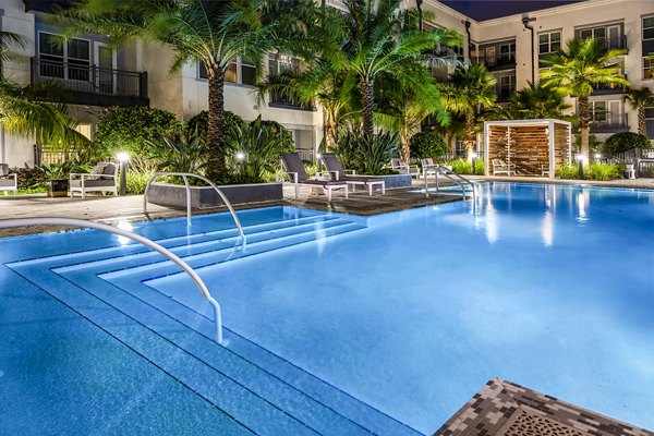 Refreshing outdoor pool at Overture Dr Phillips Apartments with modern lounge area
