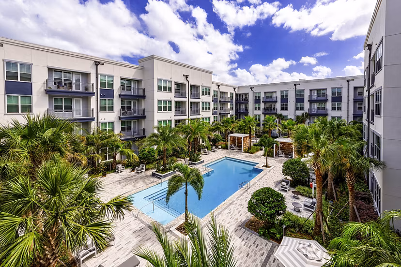Indoor pool with loungers at Overture Dr Phillips Apartments, a luxury Greystar community