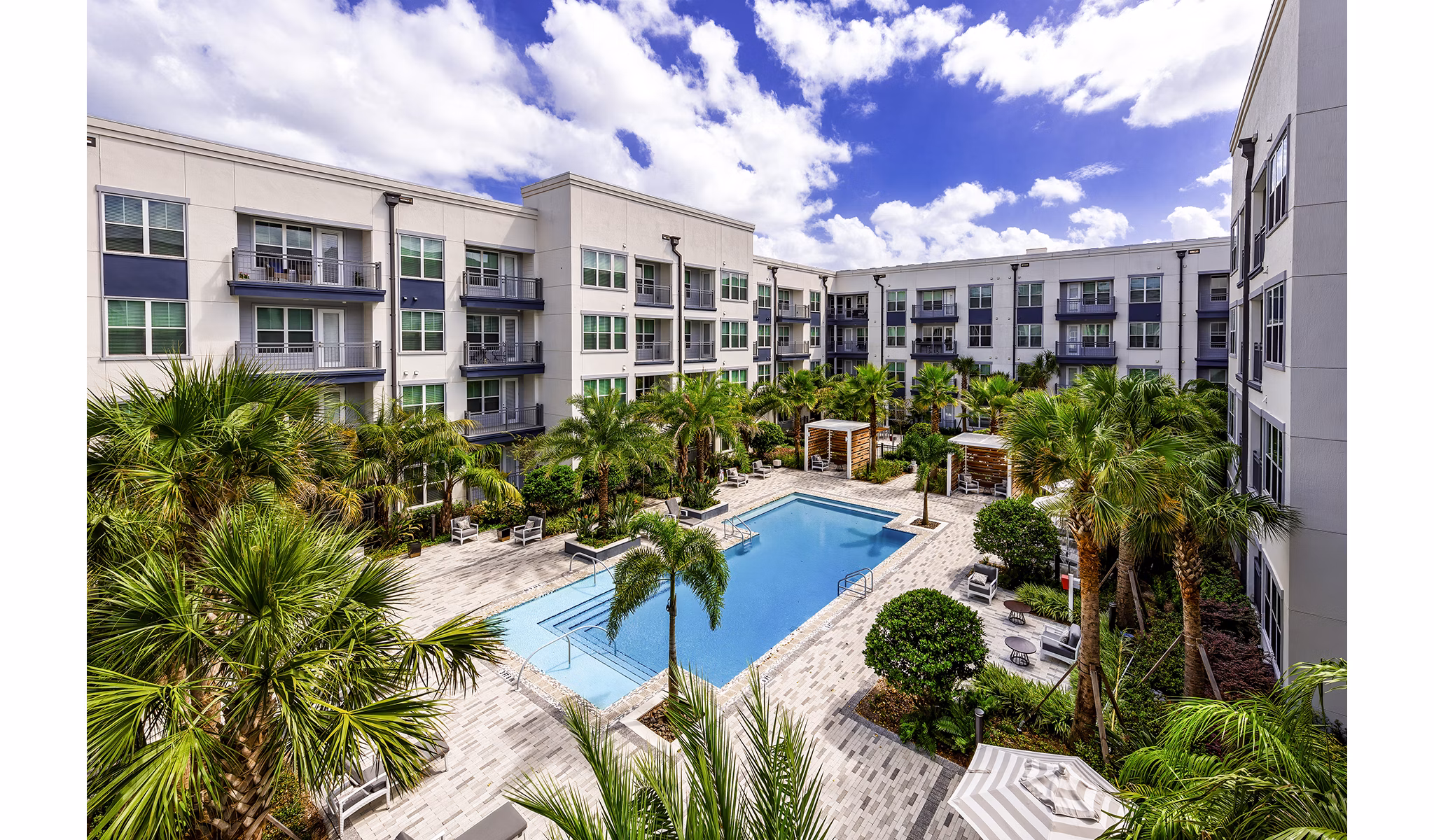 Indoor pool with loungers at Overture Dr Phillips Apartments, a luxury Greystar community