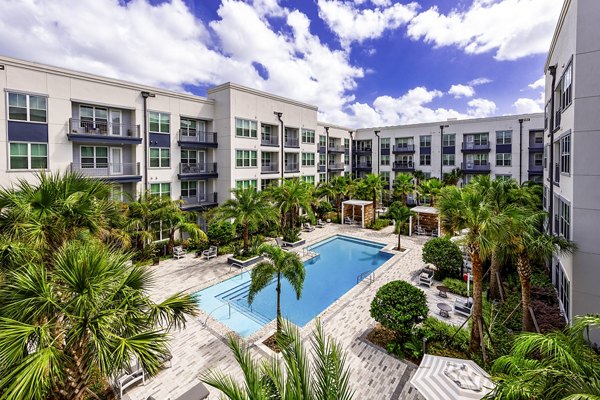 Indoor pool with loungers at Overture Dr Phillips Apartments, a luxury Greystar community
