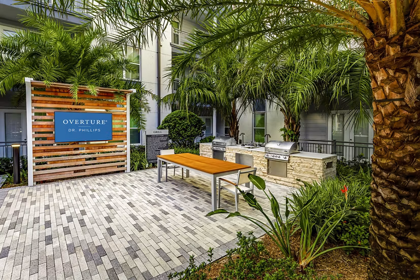 Grill area with modern seating at Overture Dr Phillips Apartments