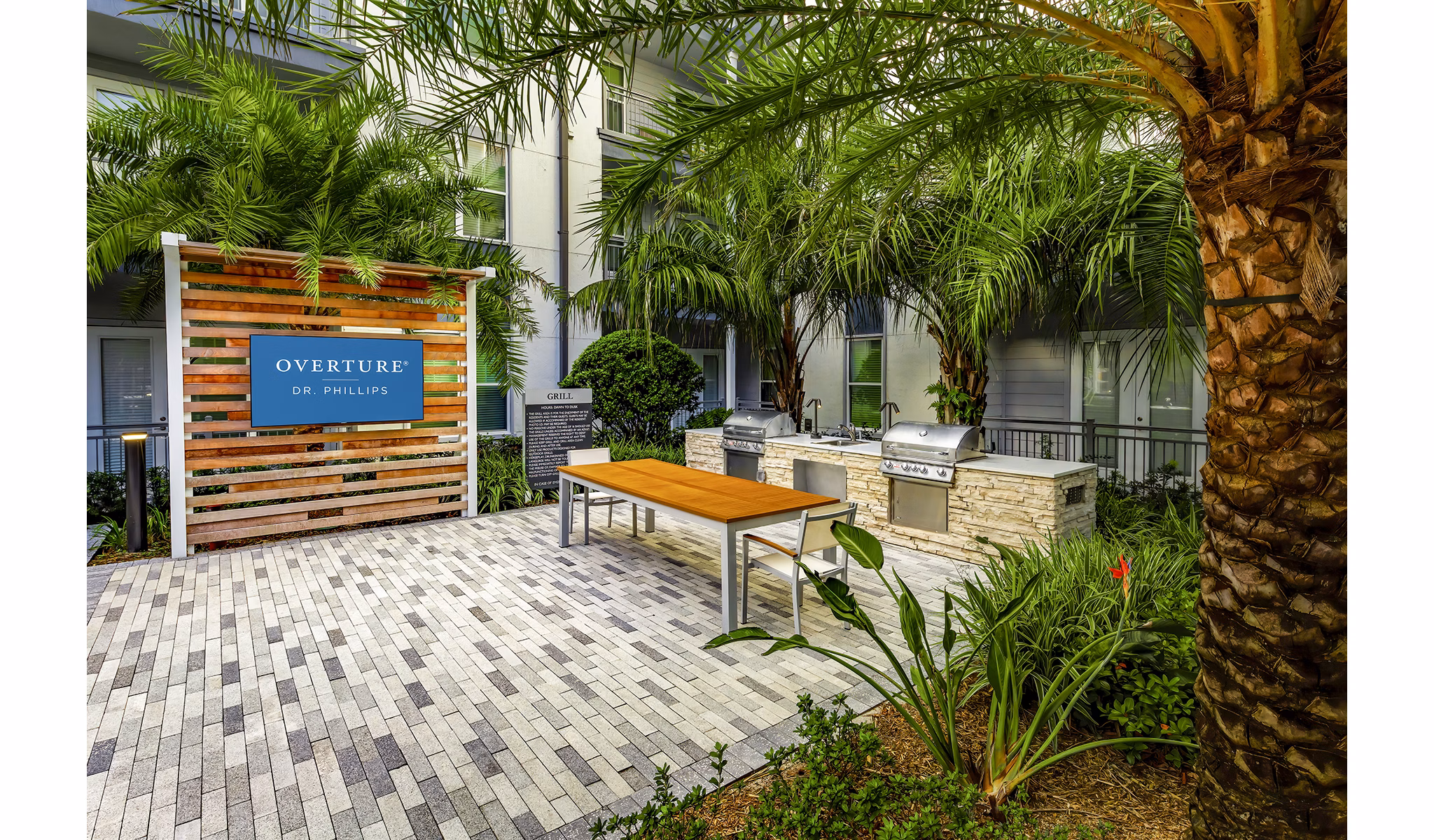 Grill area with modern seating at Overture Dr Phillips Apartments