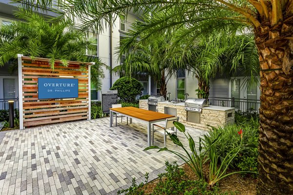 Grill area with modern seating at Overture Dr Phillips Apartments