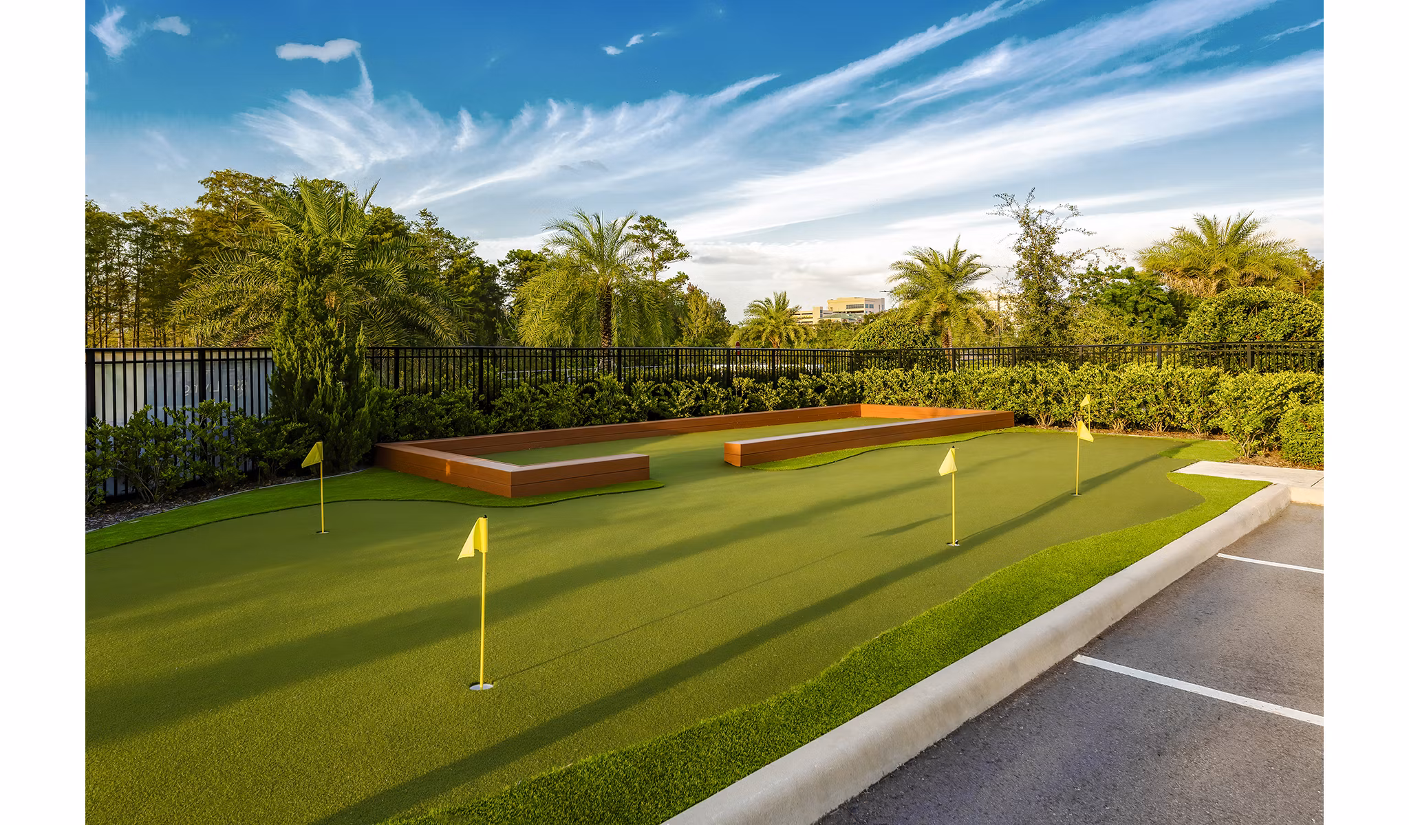 Charming putting green at Overture Dr Phillips Apartments, Orlando, ideal for resident golf enthusiasts seeking leisure and relaxation