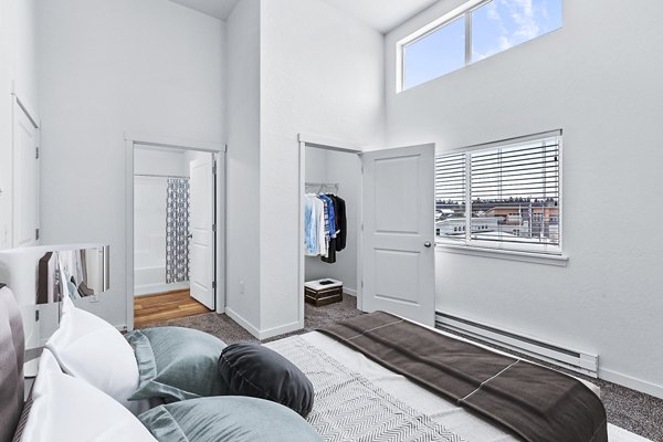 Stylish bedroom with contemporary decor at The Northern at Coeur d'Alene Place Apartments