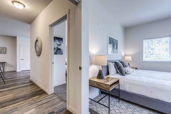 Elegant bedroom with stylish decor at The Northern at Coeur d'Alene Place Apartments