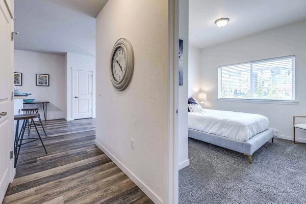 Cozy bedroom with modern decor at The Northern at Coeur d'Alene Place Apartments