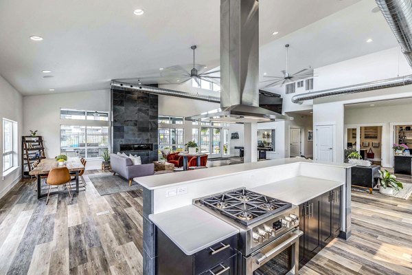 Clubhouse featuring modern design and ample seating at The Northern at Coeur d'Alene Place Apartments