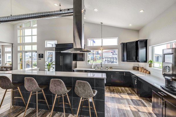Clubhouse featuring modern design and cozy seating at The Northern at Coeur d'Alene Place Apartments