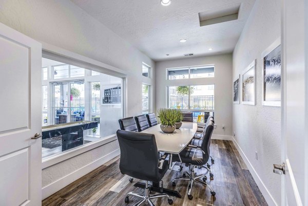 Clubhouse meeting facility with modern furnishings at The Northern at Coeur d'Alene Place Apartments