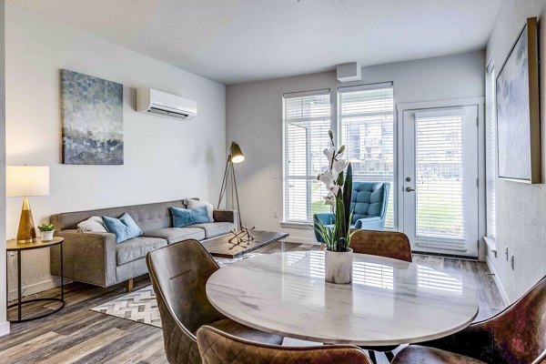 Dining room featuring contemporary design and elegant lighting in The Northern at Coeur d'Alene Place Apartments
