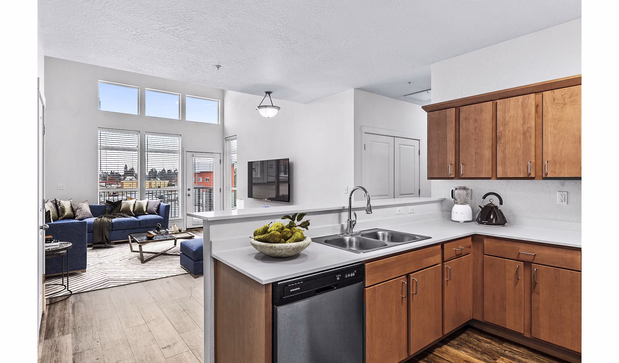 Modern kitchen with stainless steel appliances at The Northern at Coeur d'Alene Place Apartments