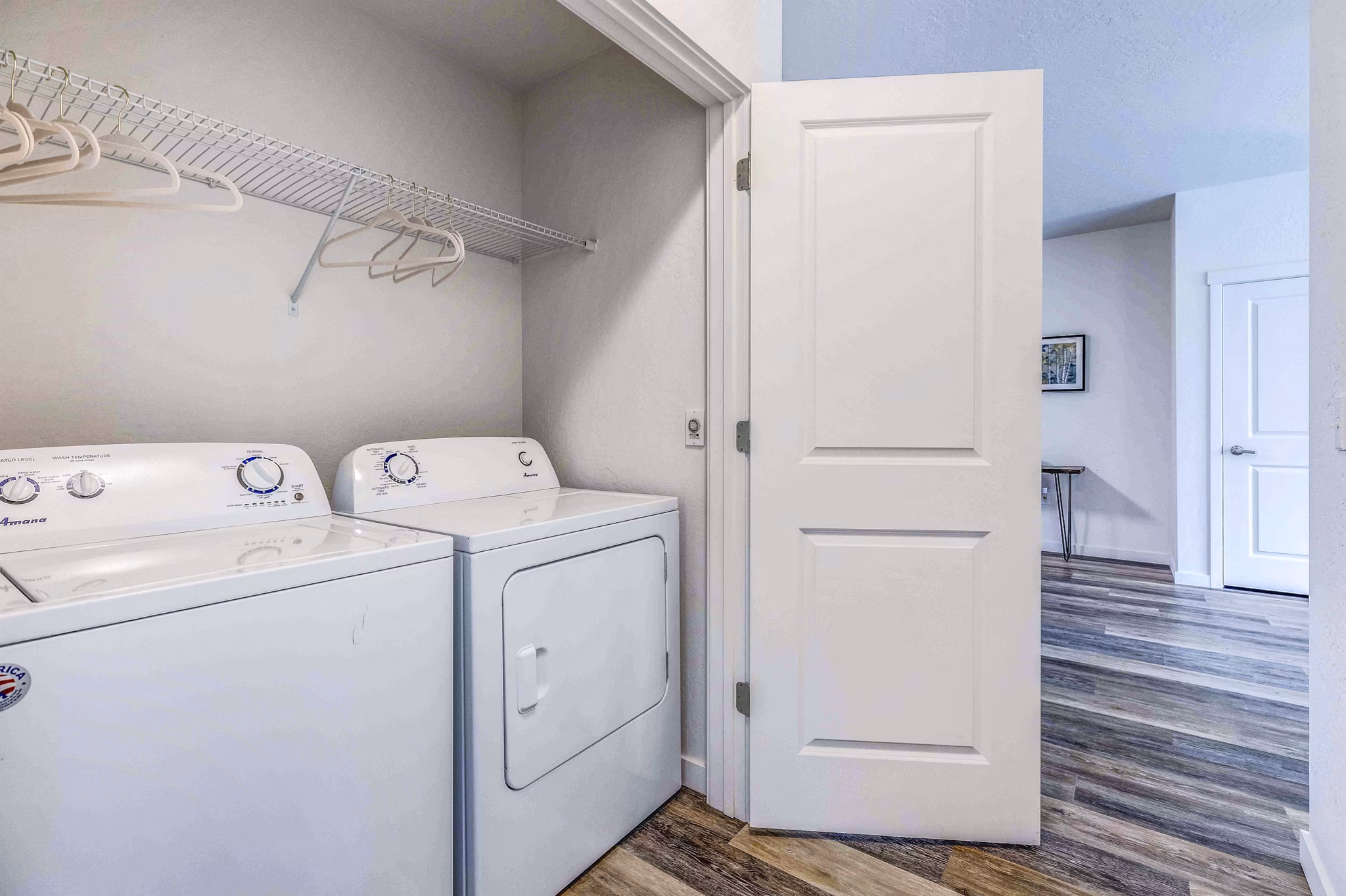 Laundry room with modern appliances at The Northern at Coeur d'Alene Place Apartments