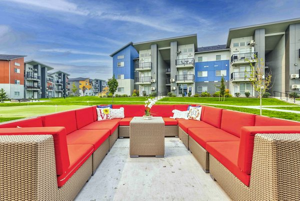 Cozy outdoor patio with modern seating at The Northern at Coeur d'Alene Place Apartments