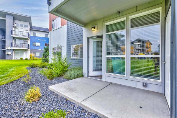 Patio area at The Northern at Coeur d'Alene Place Apartments featuring comfortable seating and scenic views