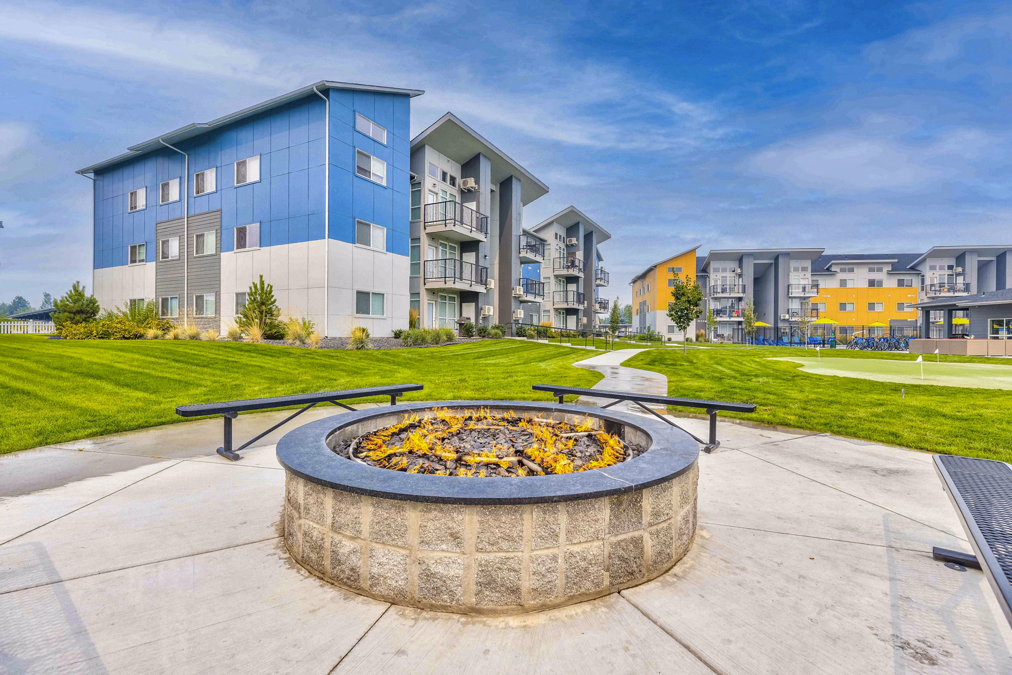 Fire pit and patio area at The Northern at Coeur d'Alene Place Apartments offering outdoor leisure space