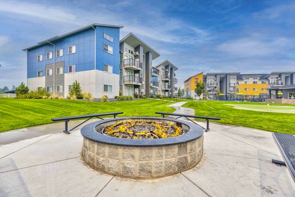 Fire pit and patio area at The Northern at Coeur d'Alene Place Apartments offering outdoor leisure space