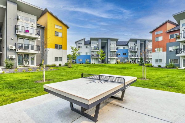 Modern recreation room with table tennis at The Northern at Coeur d'Alene Place Apartments, ideal for leisure and fitness activities
