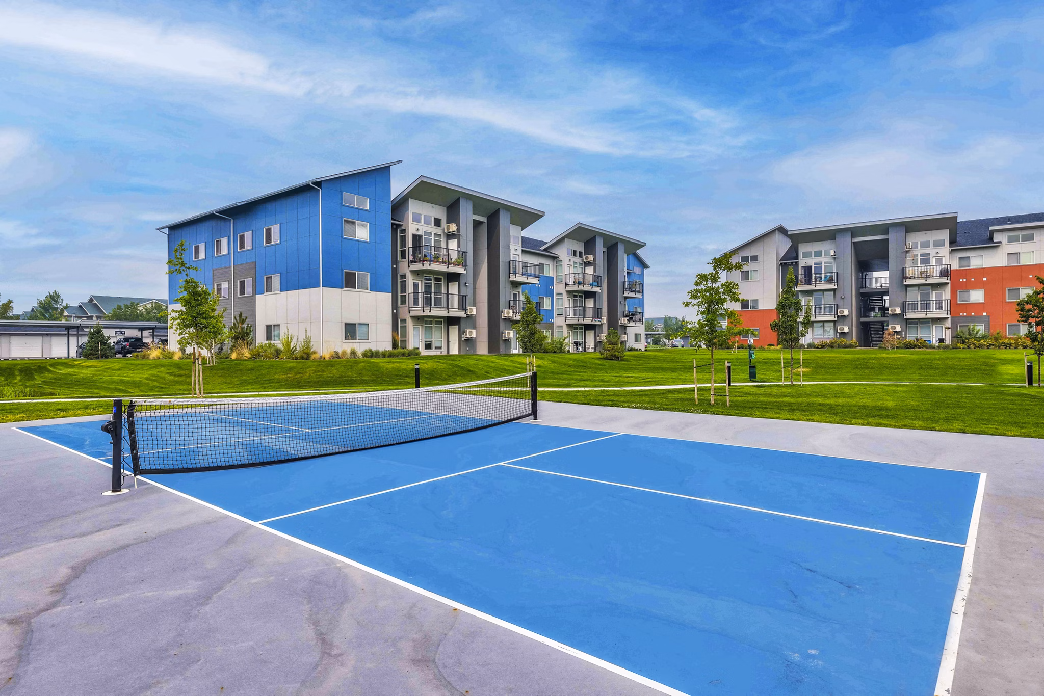 Outdoor tennis court at The Northern at Coeur d'Alene Place Apartments