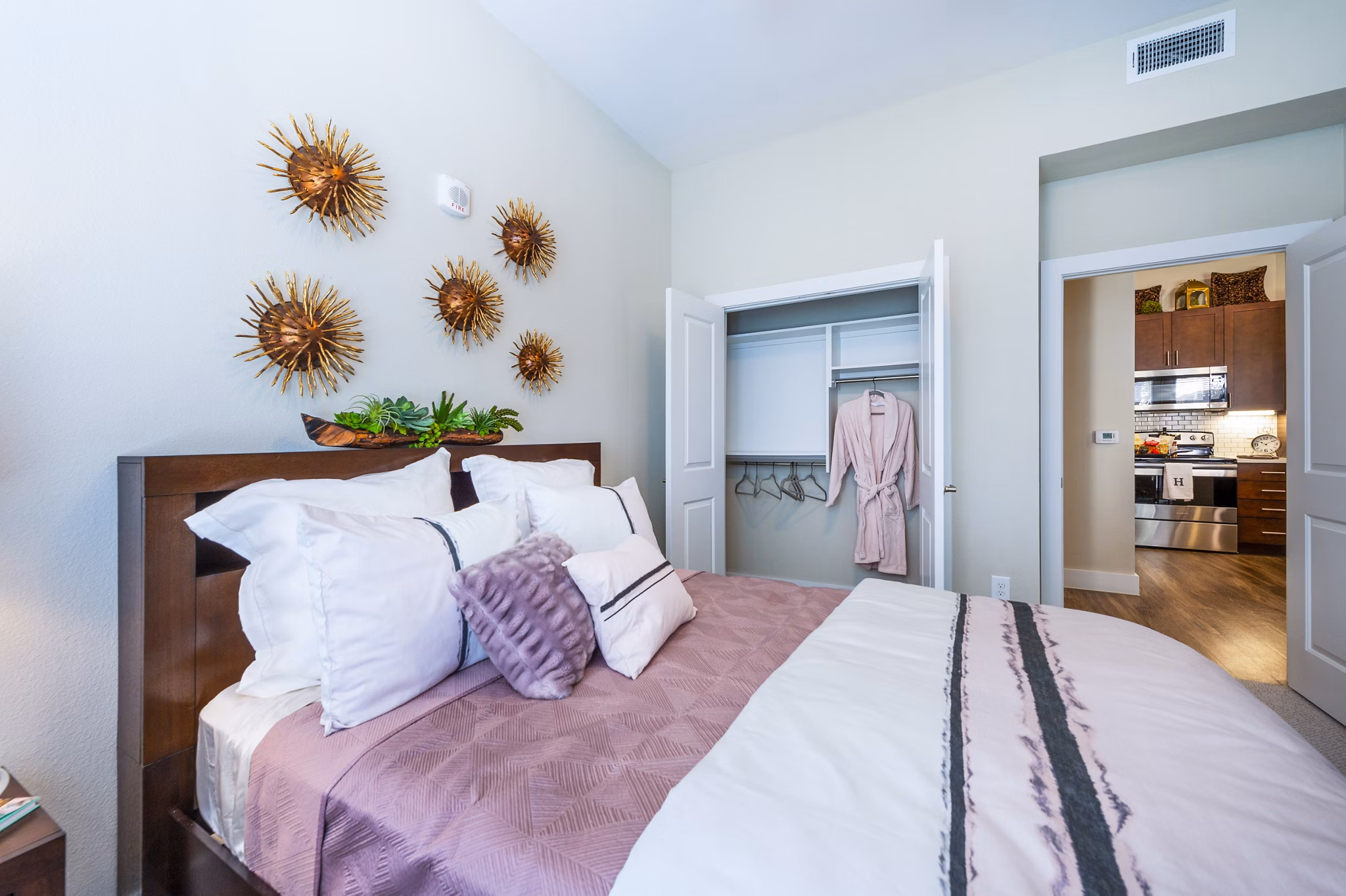 Cozy bedroom with modern furnishings at Hardy Yards Apartment Homes