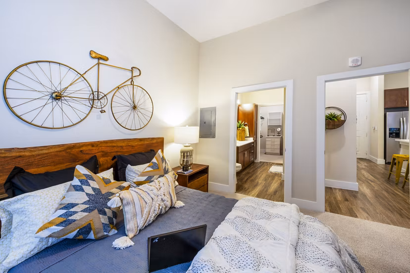 Cozy bedroom featuring modern furnishings at Hardy Yards Apartment Homes