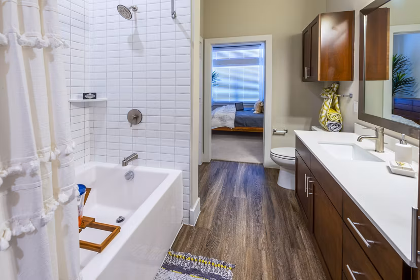 Modern bathroom with sleek fixtures at Hardy Yards Apartment Homes, featuring luxury Greystar design in Houston