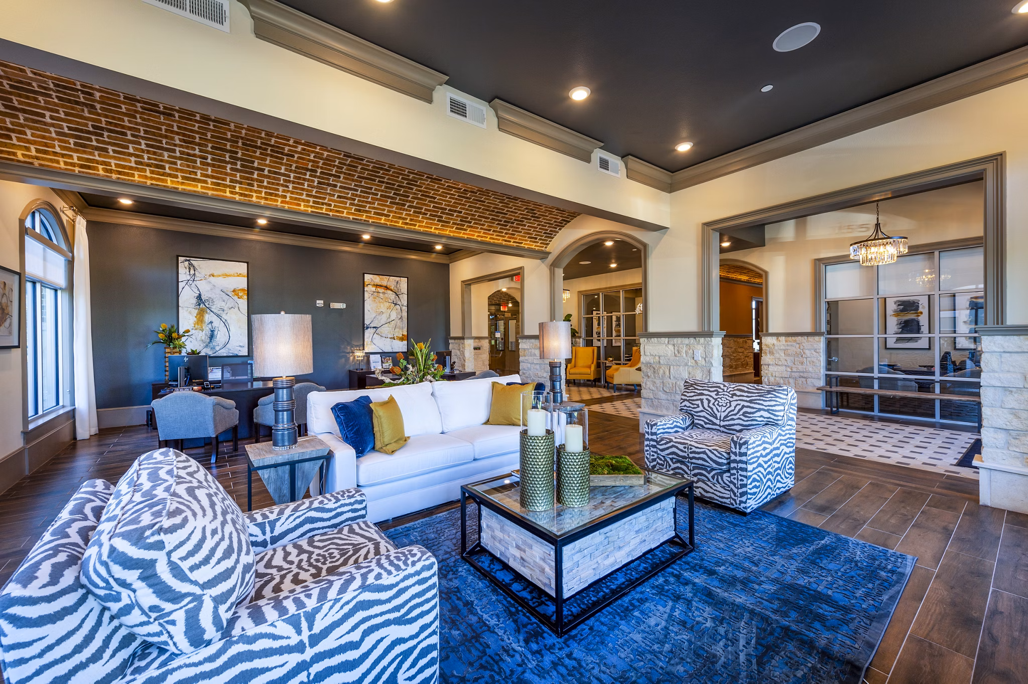 Modern clubhouse featuring lounge seating and entertainment areas at Hardy Yards Apartment Homes