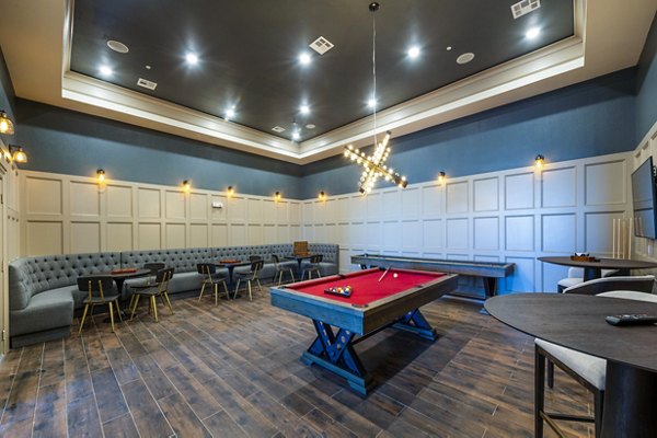 Clubhouse game room with pool table and seating at Hardy Yards Apartment Homes, luxury apartments offering recreational amenities