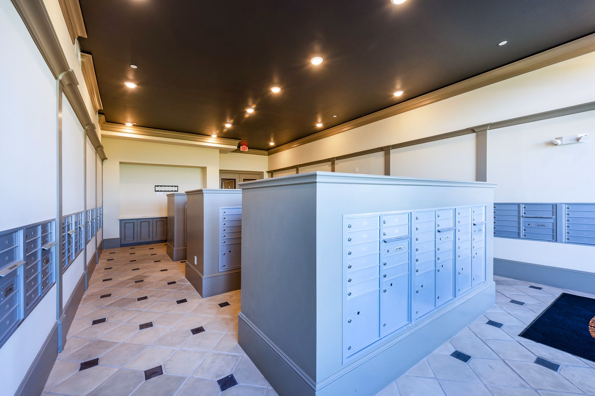 Hardy Yards Apartment Homes: Bright mail room with organized parcel lockers and secure access in Houston