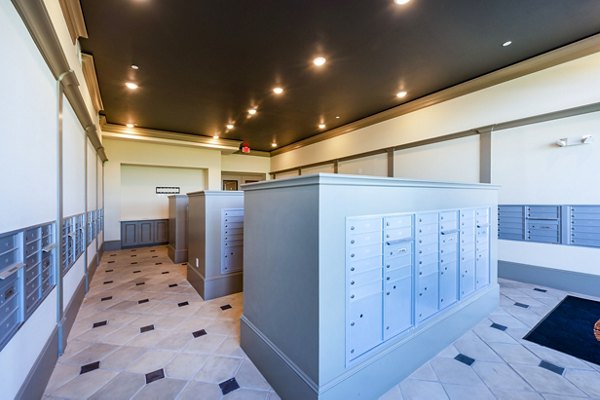 Hardy Yards Apartment Homes: Bright mail room with organized parcel lockers and secure access in Houston