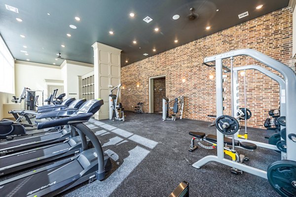 State-of-the-art fitness center at Hardy Yards Apartment Homes featuring modern equipment for a comprehensive workout experience